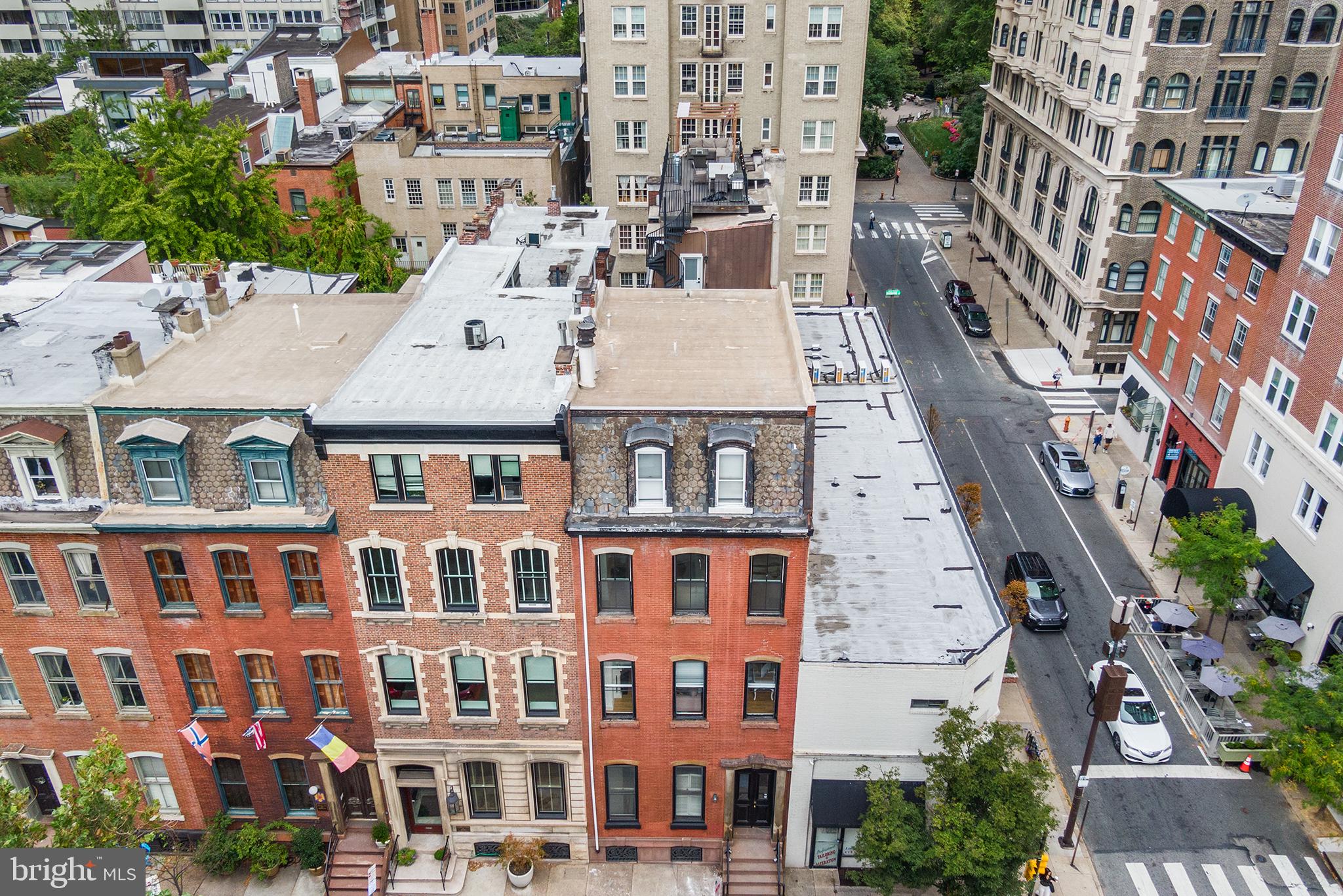 1903 Spruce Street, Unit 1A Philadelphia, PA 19103 - Photo 18 of 22 aerial view of a brick building next to a large building