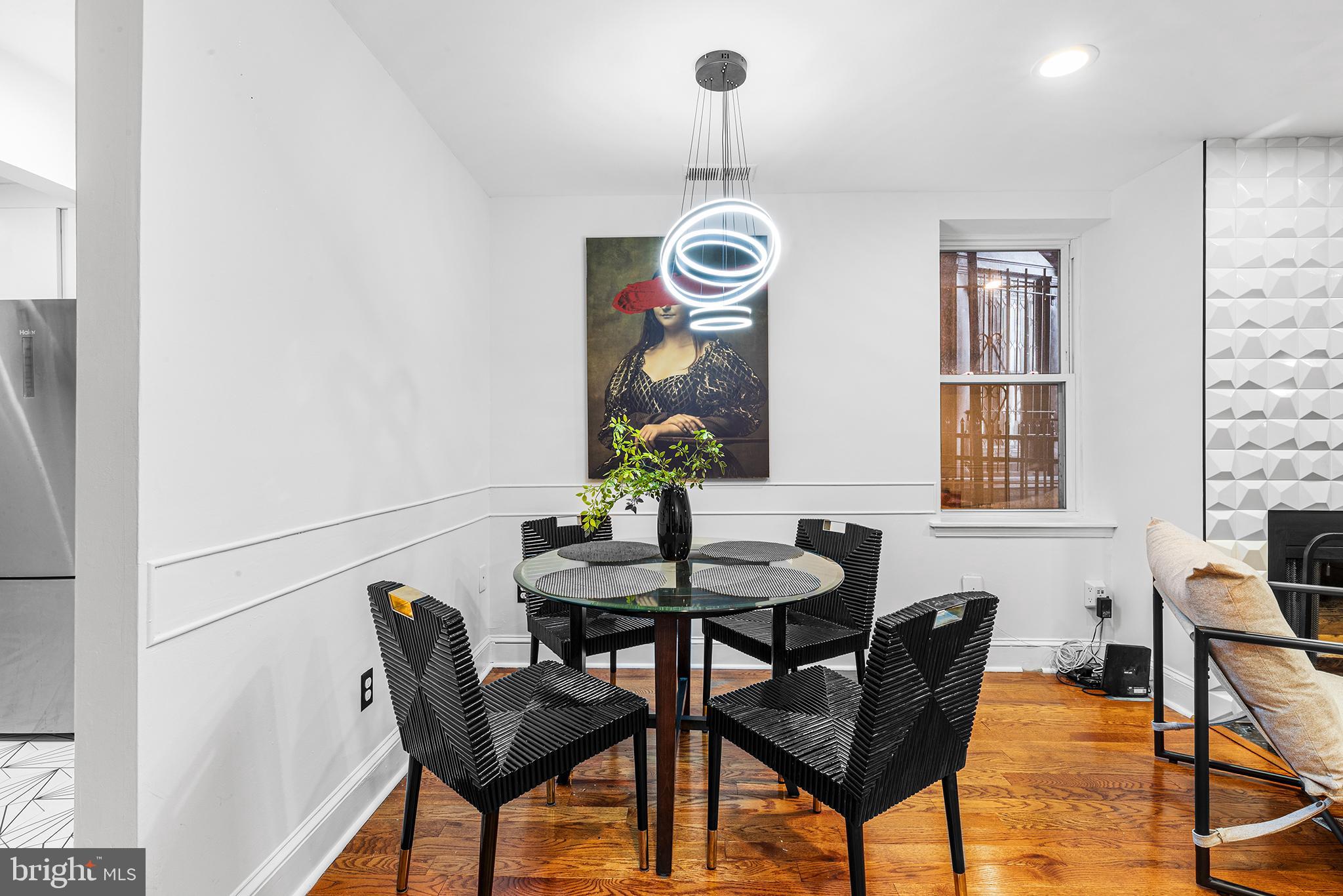 1903 Spruce Street, Unit 1A Philadelphia, PA 19103 - Photo 2 of 22 a view of a dining room with furniture and chandelier