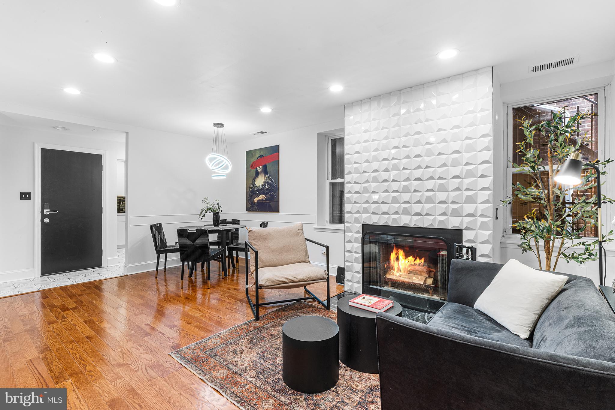1903 Spruce Street, Unit 1A Philadelphia, PA 19103 - Photo 3 of 22 a living room with furniture and a fireplace