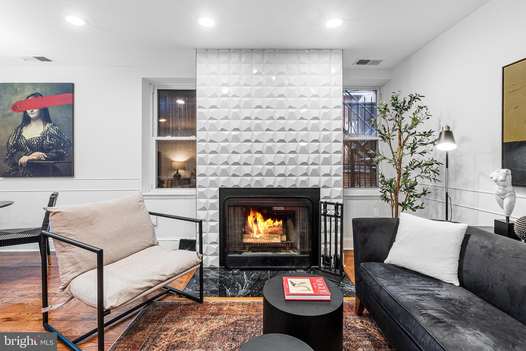 1903 Spruce Street, Unit 1A Philadelphia, PA 19103 - Photo 6 of 22 a living room with furniture and a fireplace