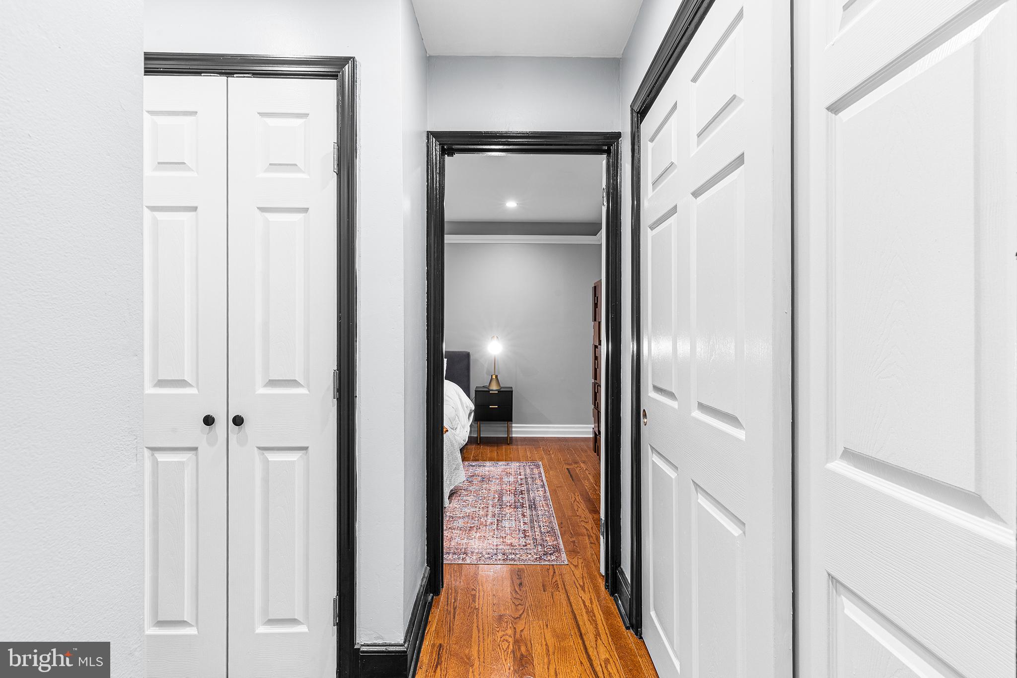 1903 Spruce Street, Unit 1A Philadelphia, PA 19103 - Photo 10 of 22 a view of a hallway with wooden floor and a bathroom