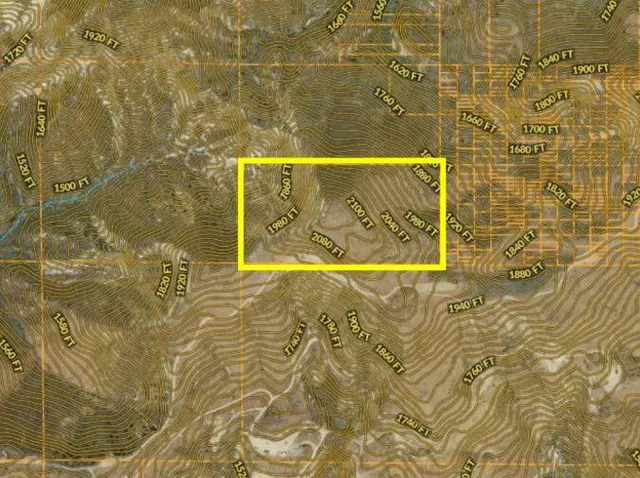 a view of a swimming pool with a yard