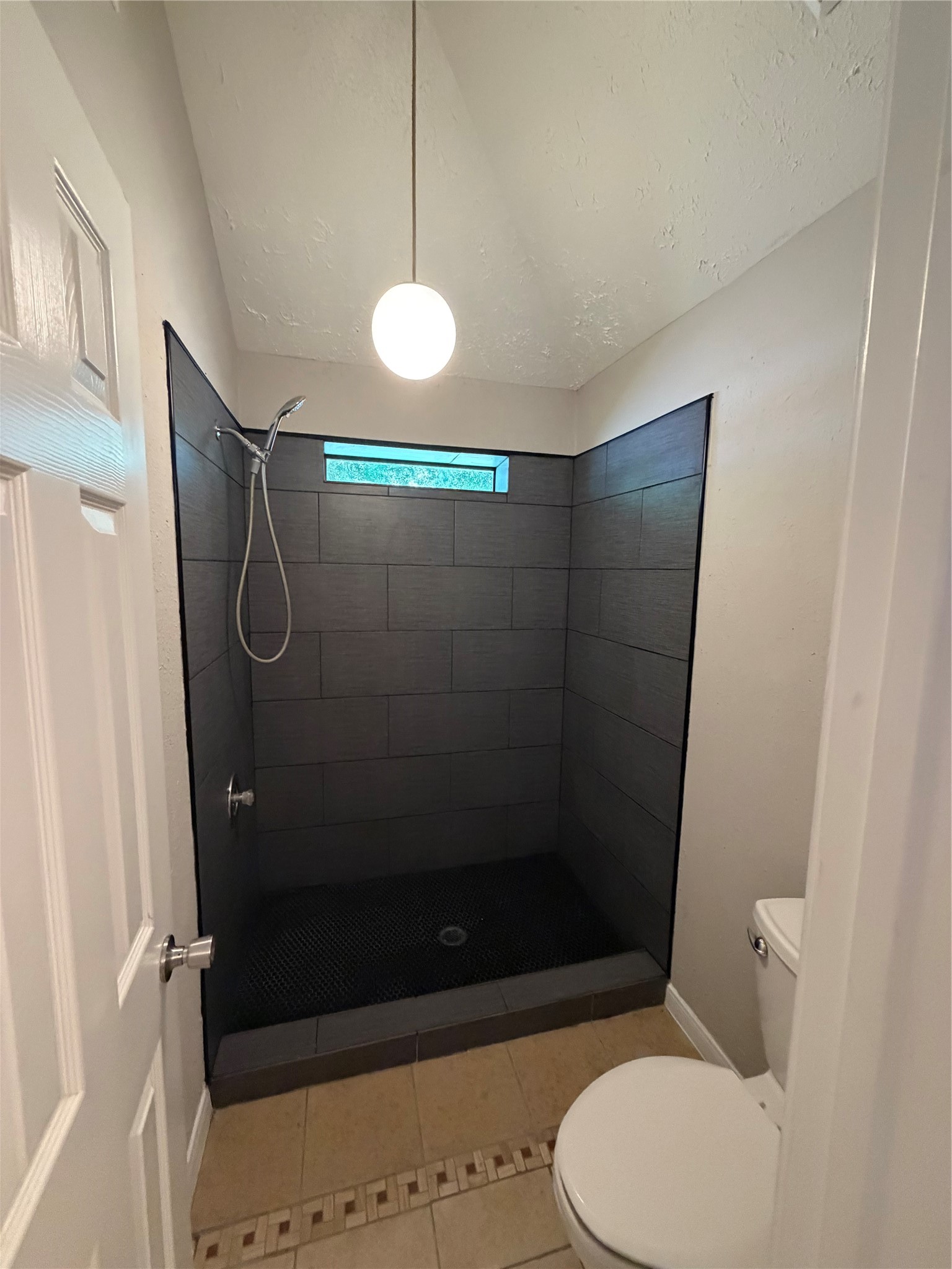 8662 Pearl Point Street Houston, TX 77044 - Photo 10 of 28 a bathroom with a shower and a toilet