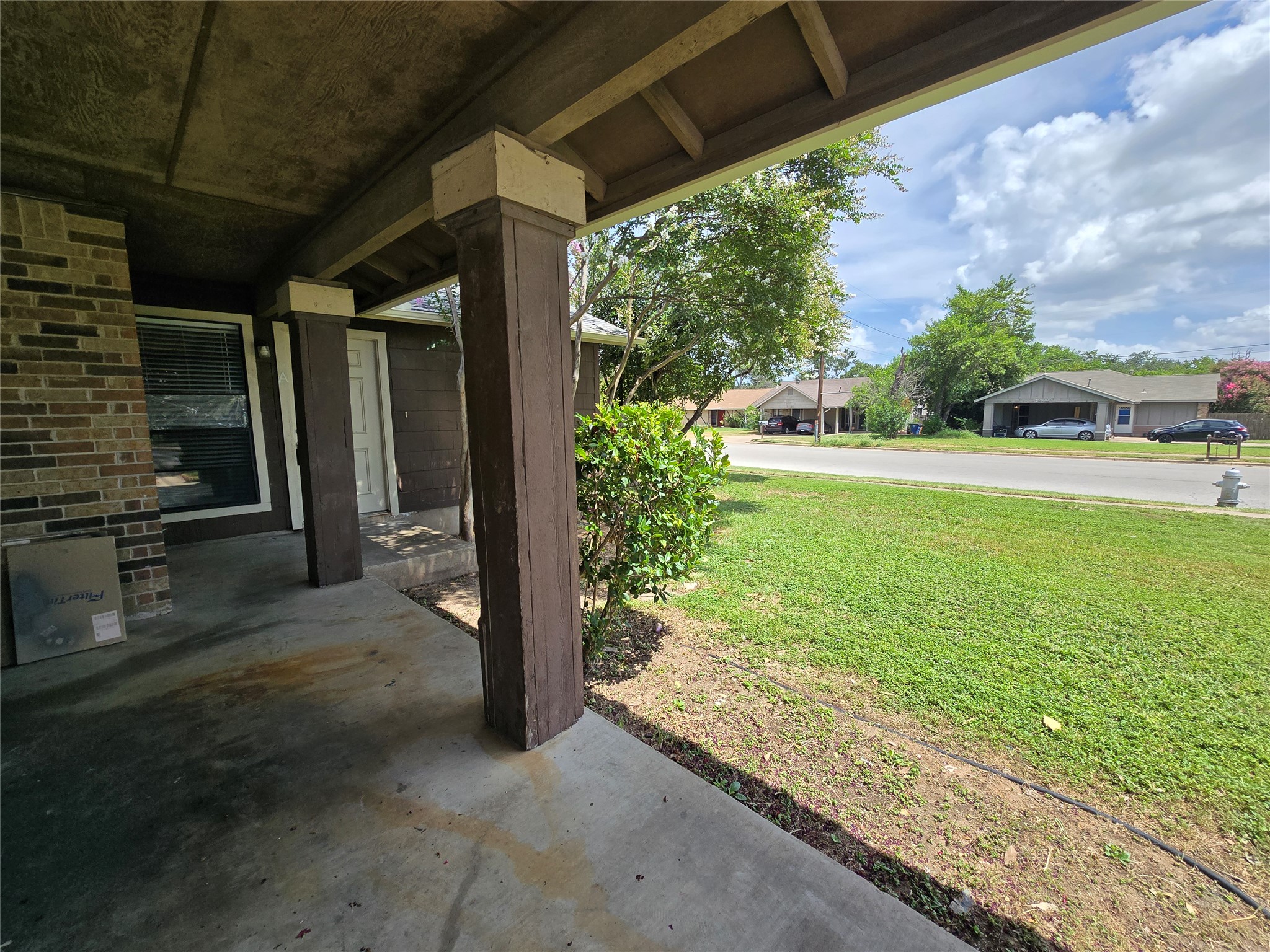 6206 Buffalo Pass, Unit A Austin, TX 78745 - Photo 3 of 24 A welcoming front porch, shaded and set for enjoying neighborhood views.