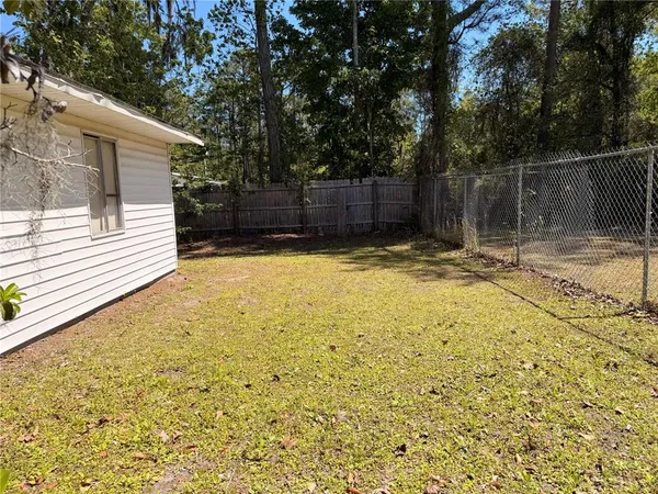 a view of a backyard of the house