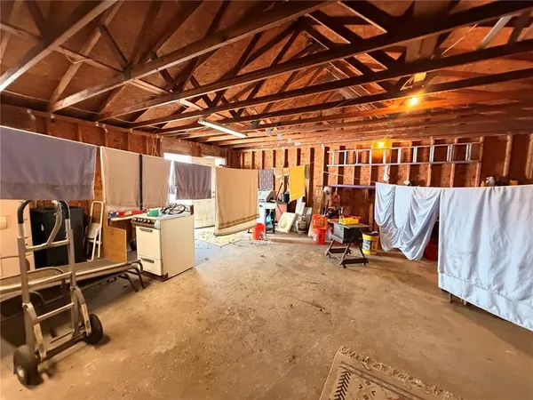 a room with lots of appliances and furniture