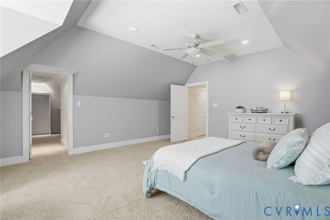 12123 Deer Ridge Court Ashland, VA 23005 - Photo 52 of 63 a bedroom with a bed and a ceiling fan