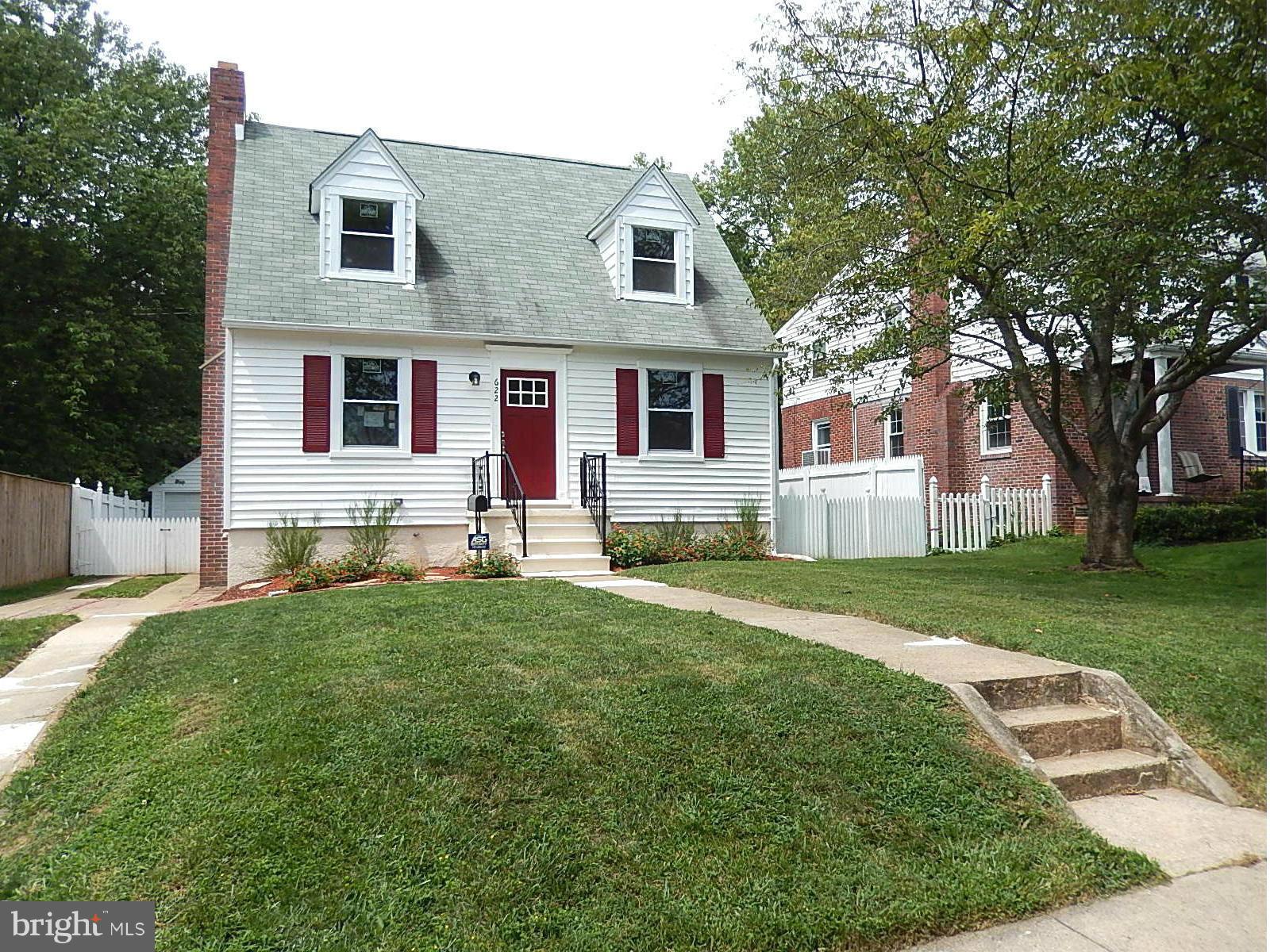 622 Warwick Road Baltimore, MD 21229 - Photo 1 of 29 a front view of a house with a yard