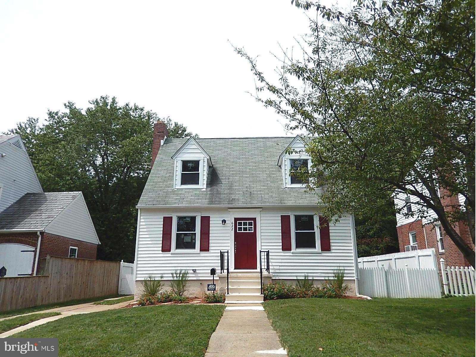 622 Warwick Road Baltimore, MD 21229 - Photo 2 of 29 a front view of house with yard and green space