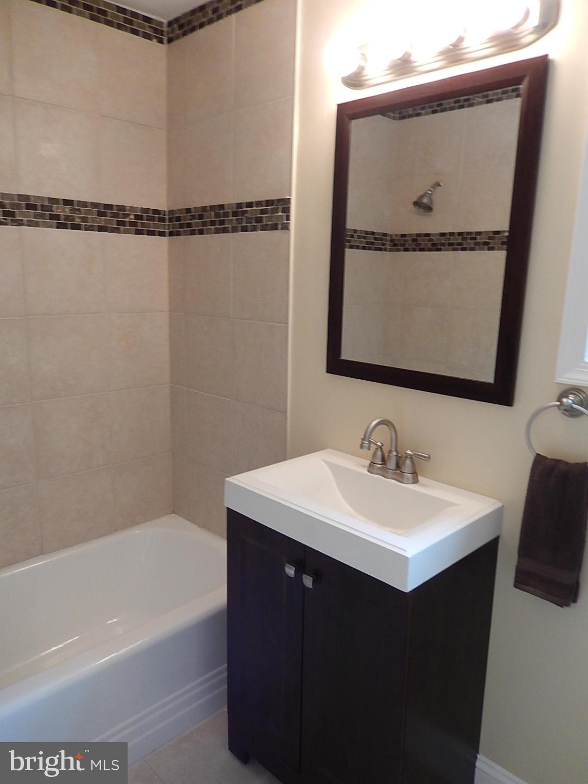 622 Warwick Road Baltimore, MD 21229 - Photo 12 of 29 a bathroom with a sink and a mirror
