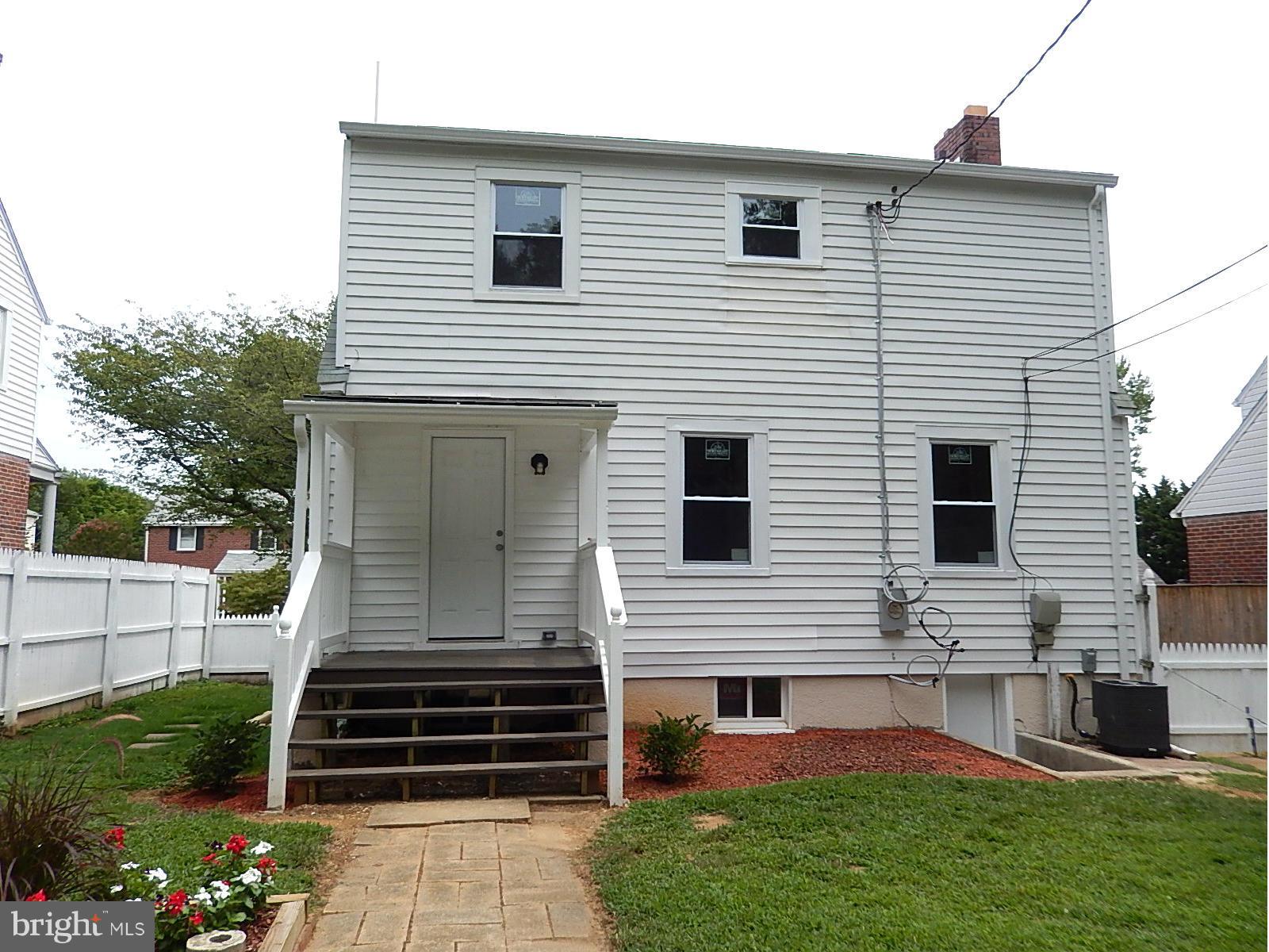 622 Warwick Road Baltimore, MD 21229 - Photo 7 of 29 a front view of a house with a yard