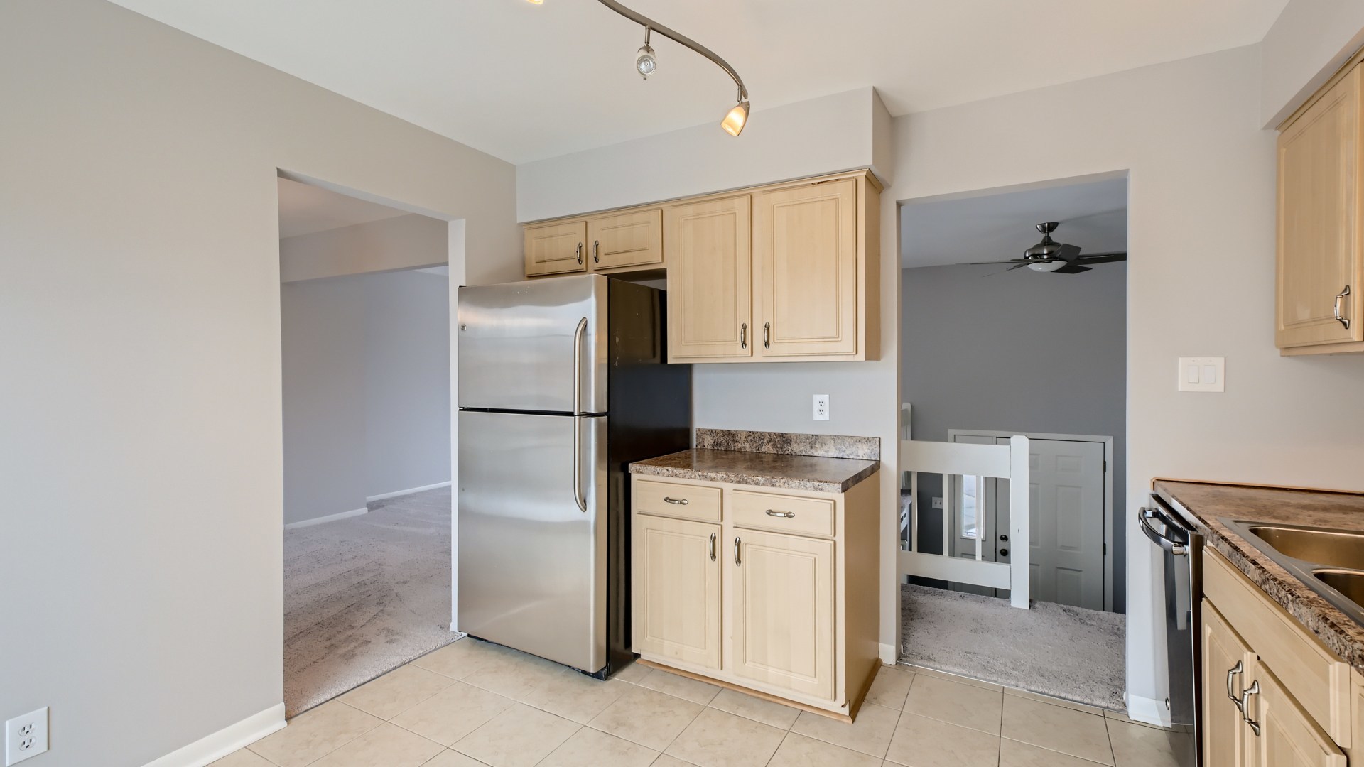 17 Windgate Court Streamwood, IL 60107 - Photo 11 of 28 a kitchen with a stove refrigerator and microwave
