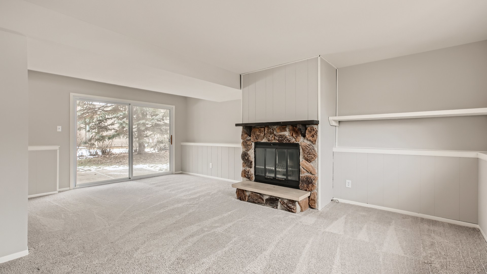 17 Windgate Court Streamwood, IL 60107 - Photo 20 of 28 a room with a fireplace and a large window