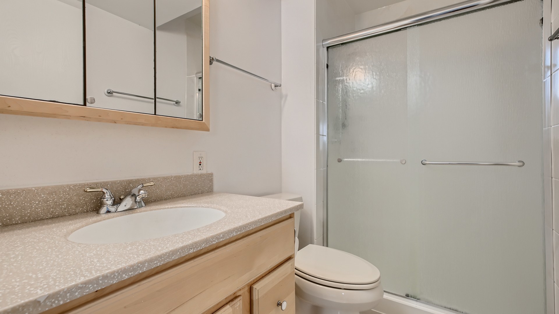 17 Windgate Court Streamwood, IL 60107 - Photo 23 of 28 a bathroom with a granite countertop sink toilet and shower