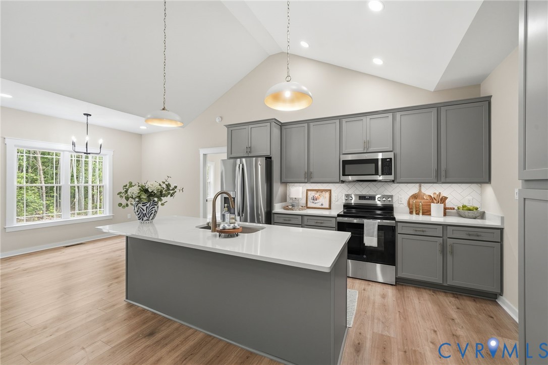 239 Bumpass Road Bumpass, VA 23024 - Photo 3 of 44 Open-concept kitchen featuring an island with a bu