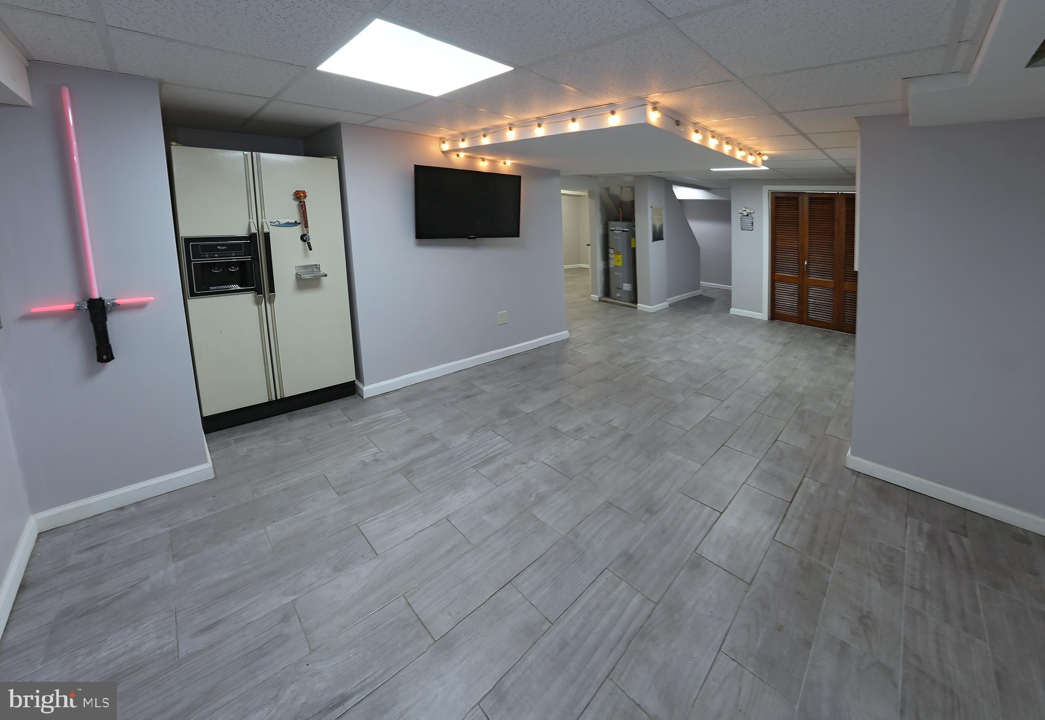 90 Elwyn Avenue Sinking Spring, PA 19608 - Photo 22 of 39 Finished basement with tile flooring