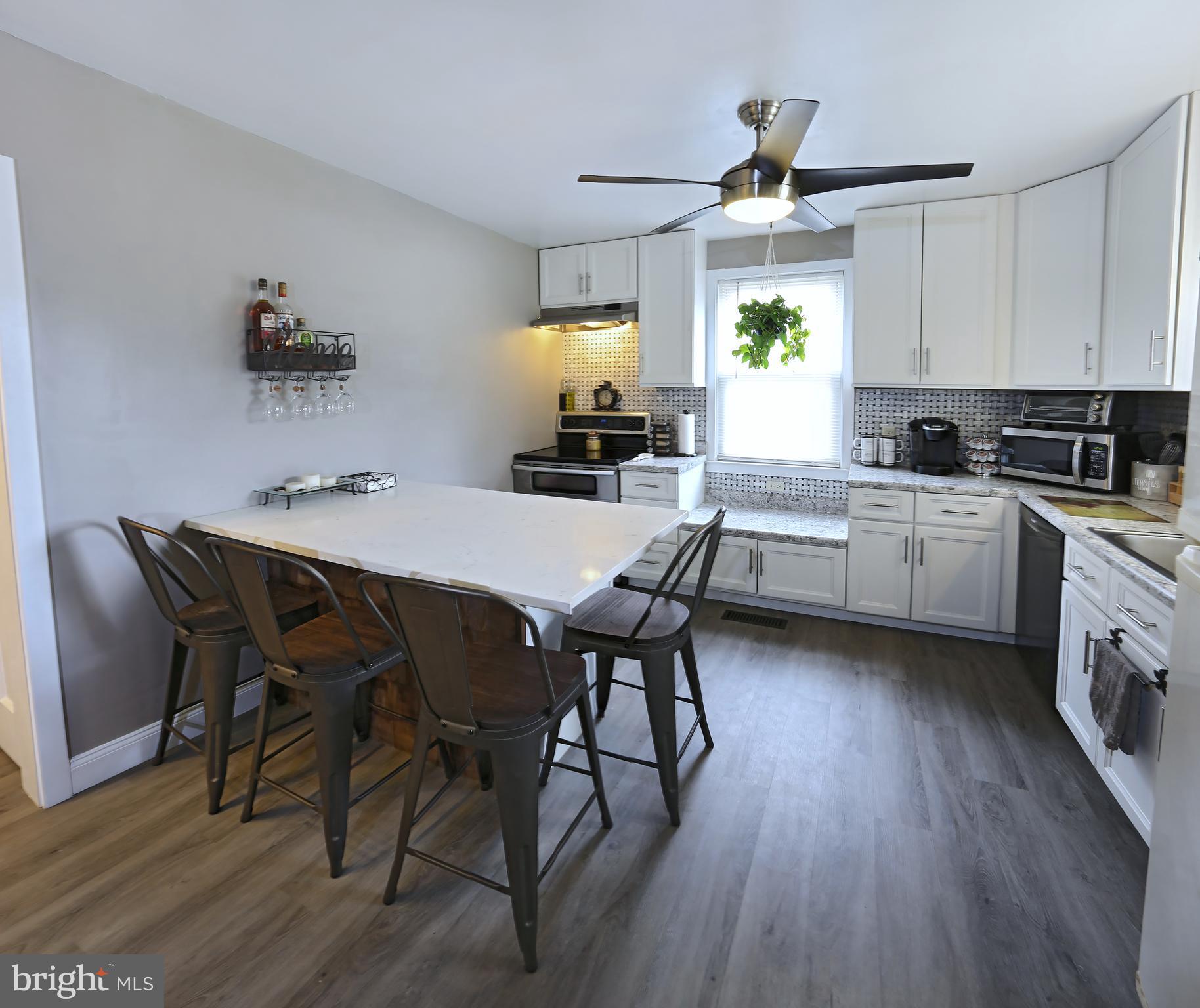 90 Elwyn Avenue Sinking Spring, PA 19608 - Photo 8 of 39 Kitchen with new cabinets, island and flooring