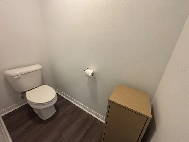 a bathroom with a toilet and a sink