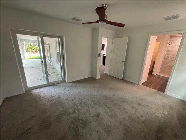 a view of empty room with windows