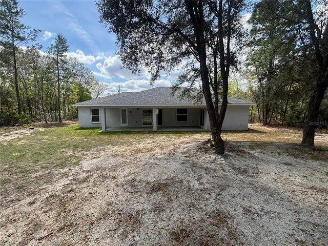 a house with trees in the background