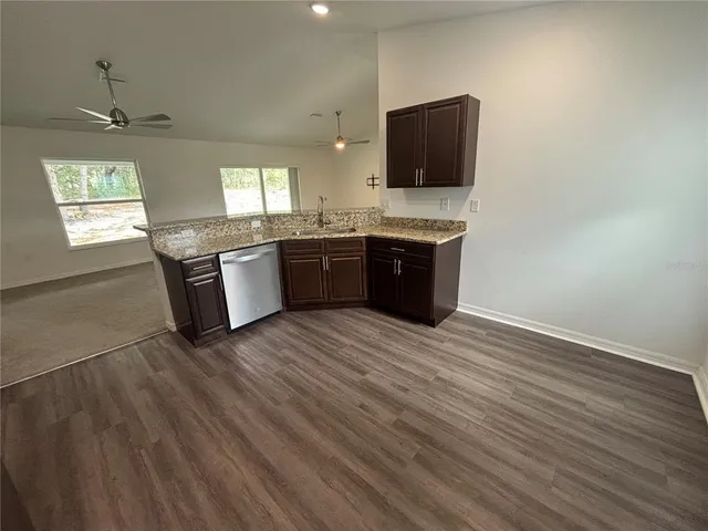 a room with a wooden floor and a flat screen tv