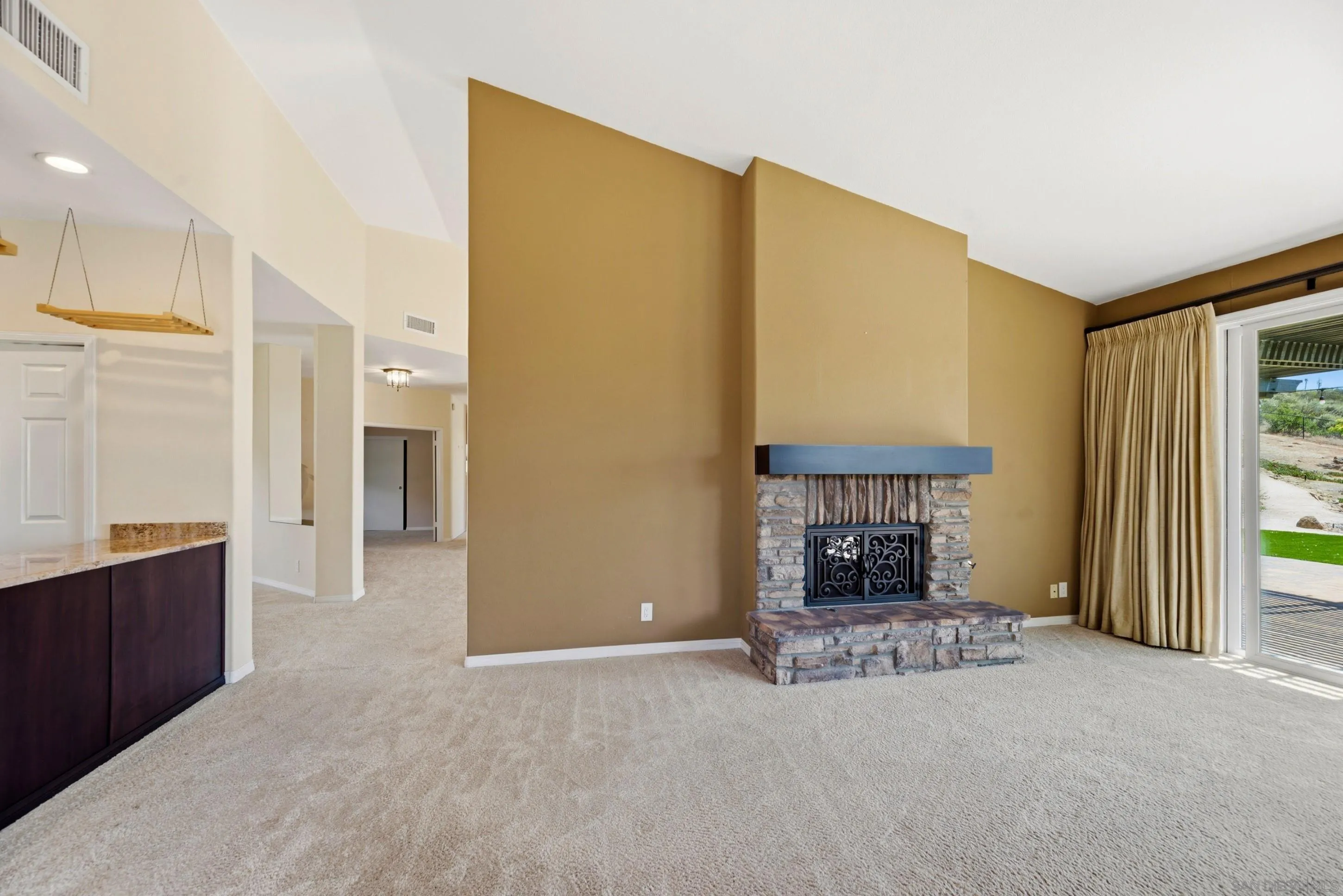 14505 Wildgrove Road Poway, CA 92064 - Photo 11 of 55 a living room with furniture a fireplace and a table