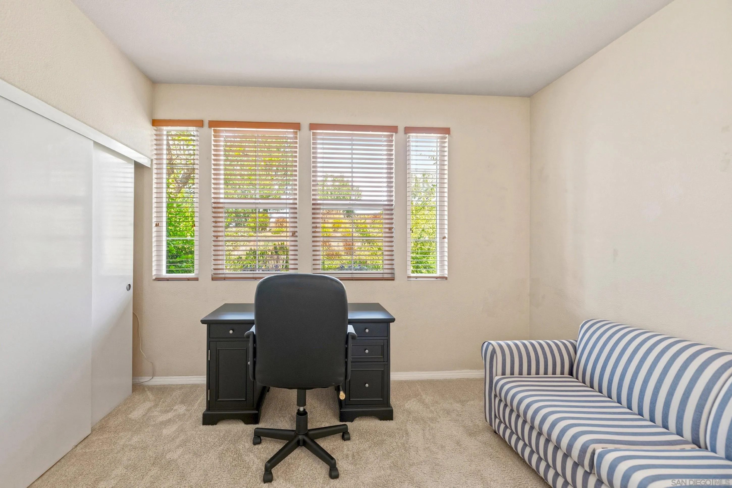 14505 Wildgrove Road Poway, CA 92064 - Photo 19 of 55 a view of a livingroom with workspace and a couch