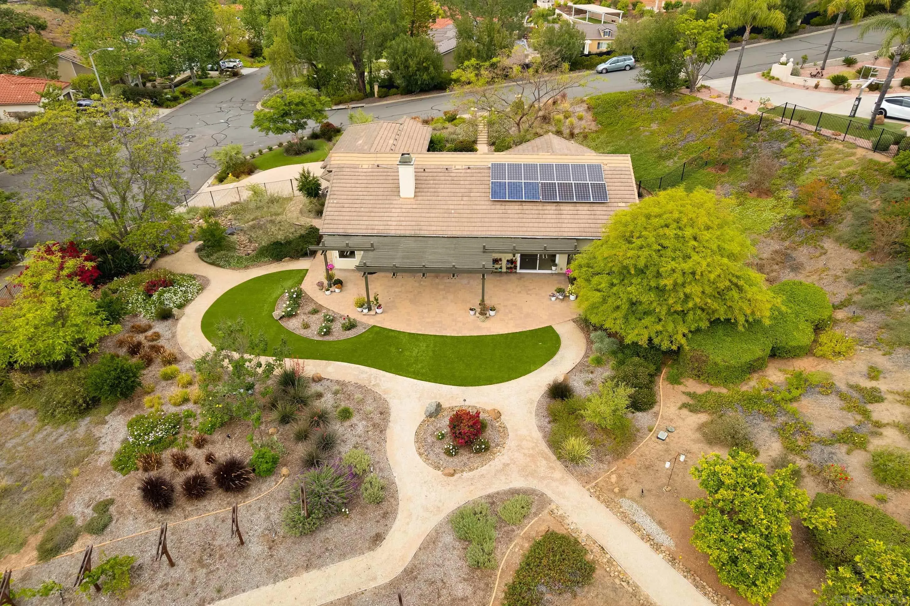 14505 Wildgrove Road Poway, CA 92064 - Photo 2 of 55 a view of a swimming pool with a yard