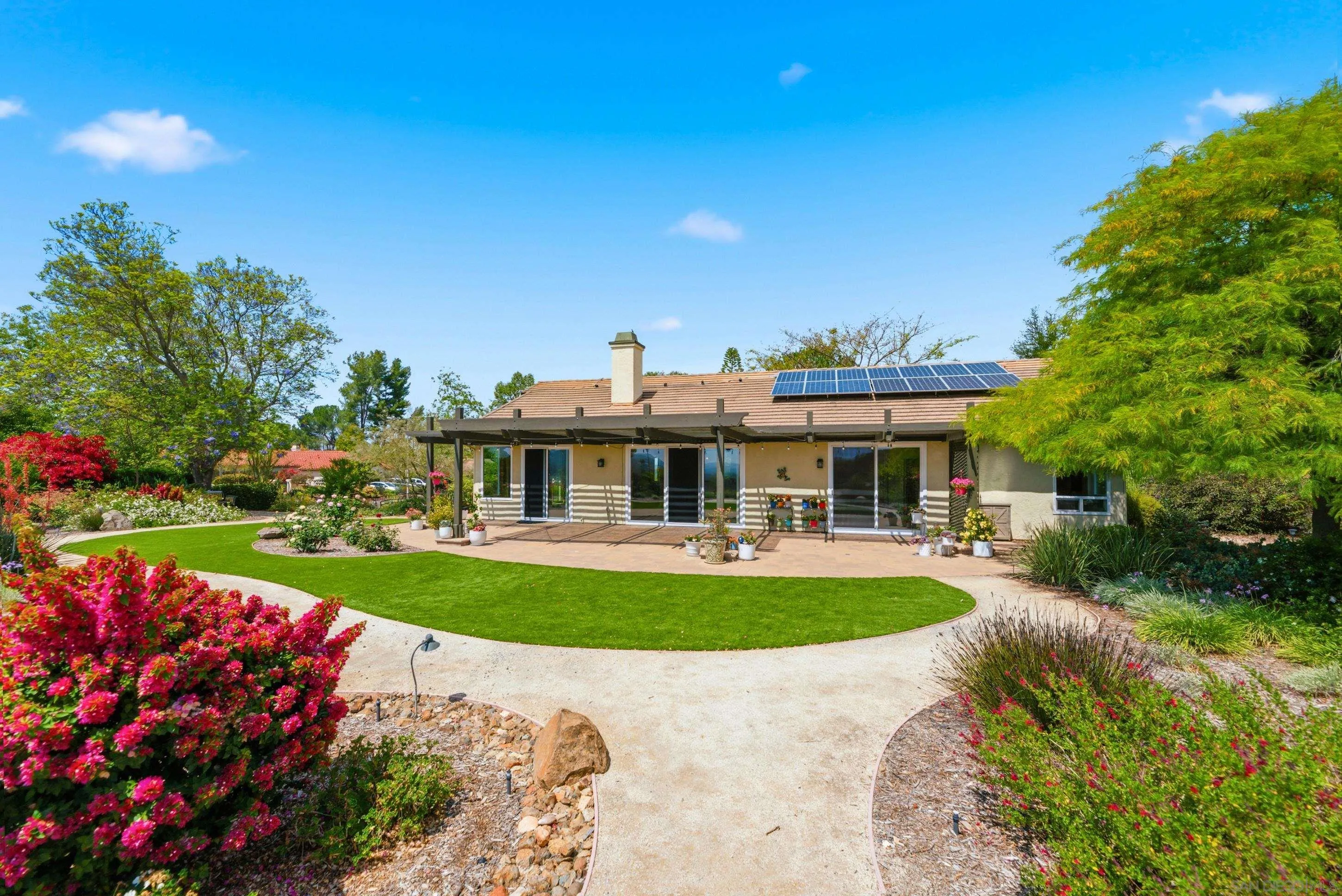 14505 Wildgrove Road Poway, CA 92064 - Photo 32 of 55 a front view of house with outdoor seating and garden