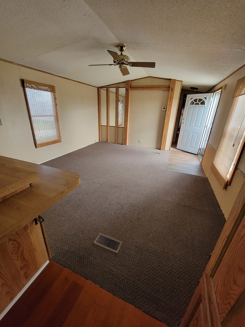 3 Drake Lane, Unit 3DRA Beecher, IL 60401 - Photo 5 of 18 a view of a room with rack and wooden floor