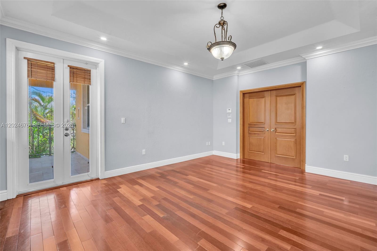 2155 Southwest 156th Court Miami, FL 33185 - Photo 41 of 57 a view of an empty room with wooden floor and a window