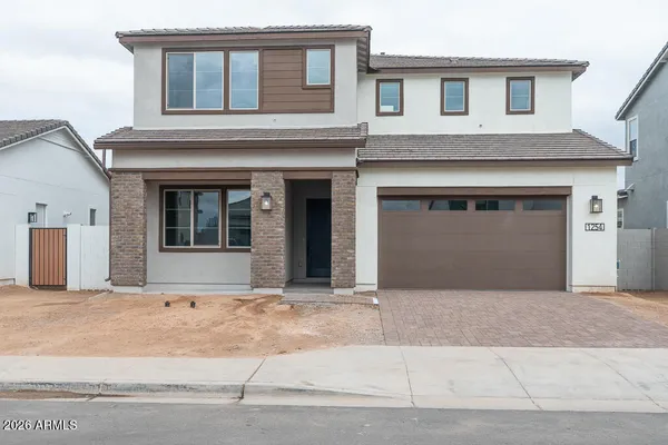 a front view of a house with a garage