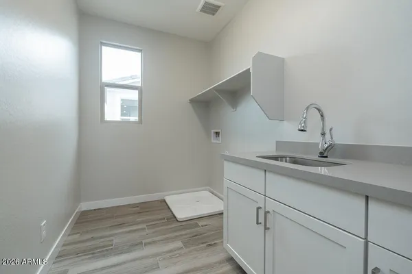 a view of a sink and a window