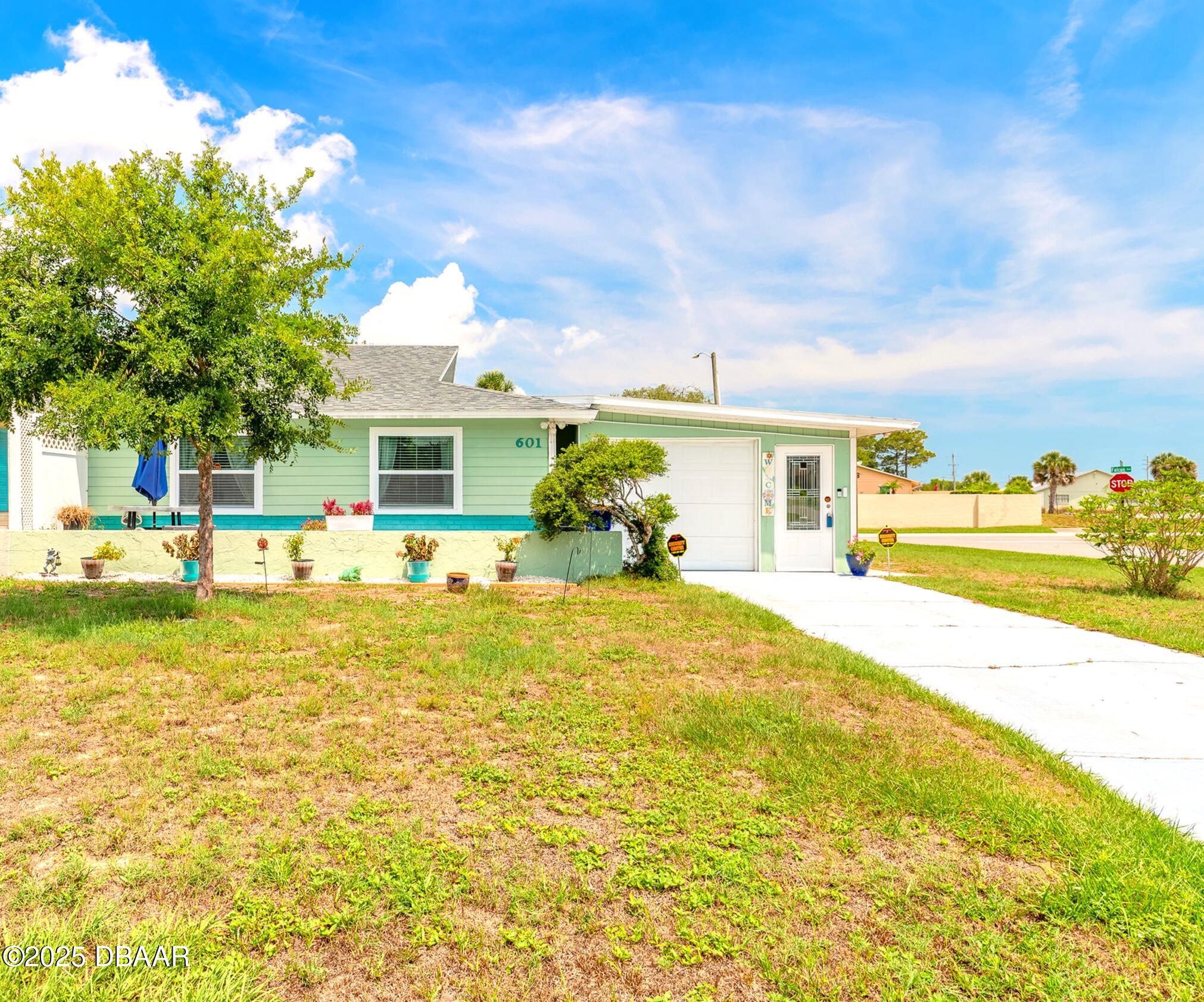 601 Sea Gull Court Edgewater, FL 32141 - Photo 1 of 25 a front view of house with a garden