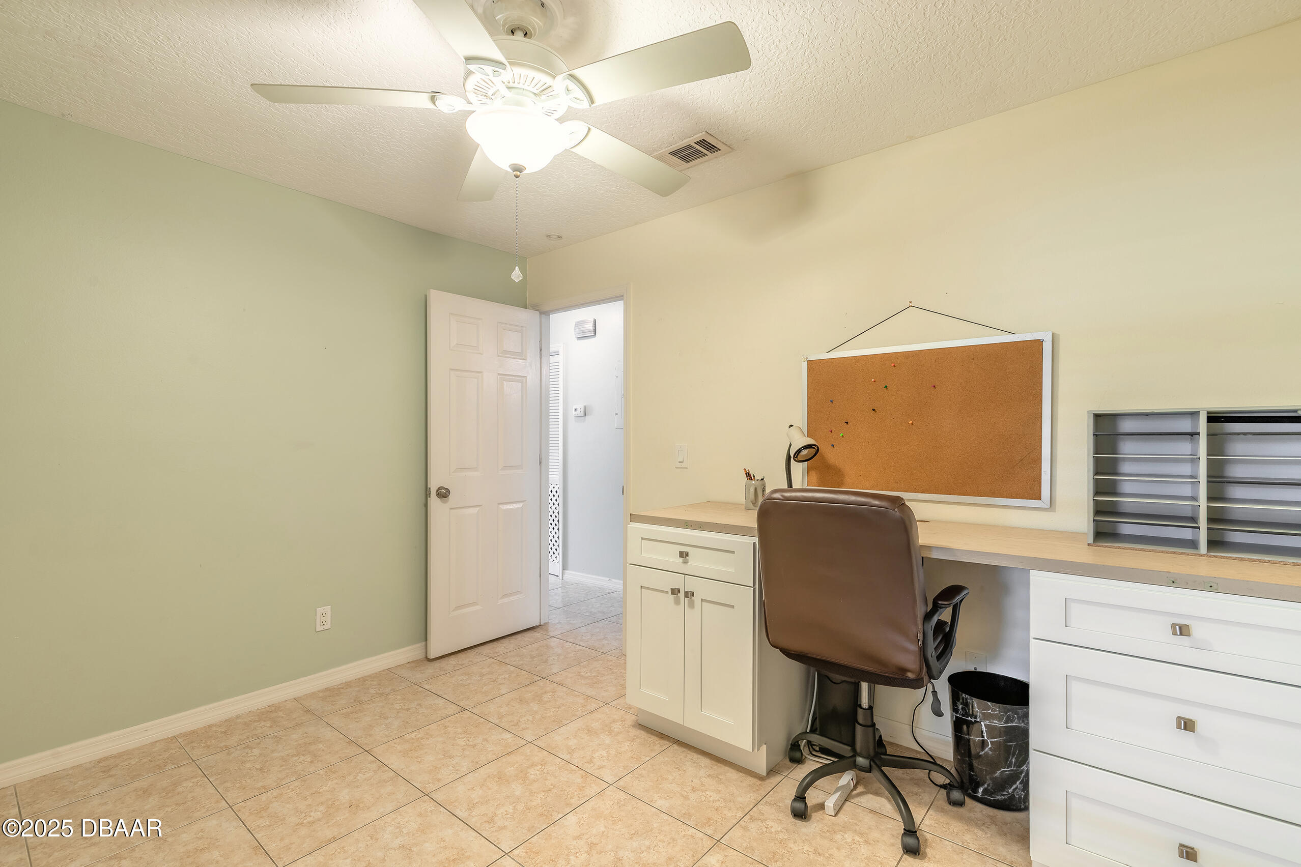 601 Sea Gull Court Edgewater, FL 32141 - Photo 15 of 25 a workspace with furniture and window