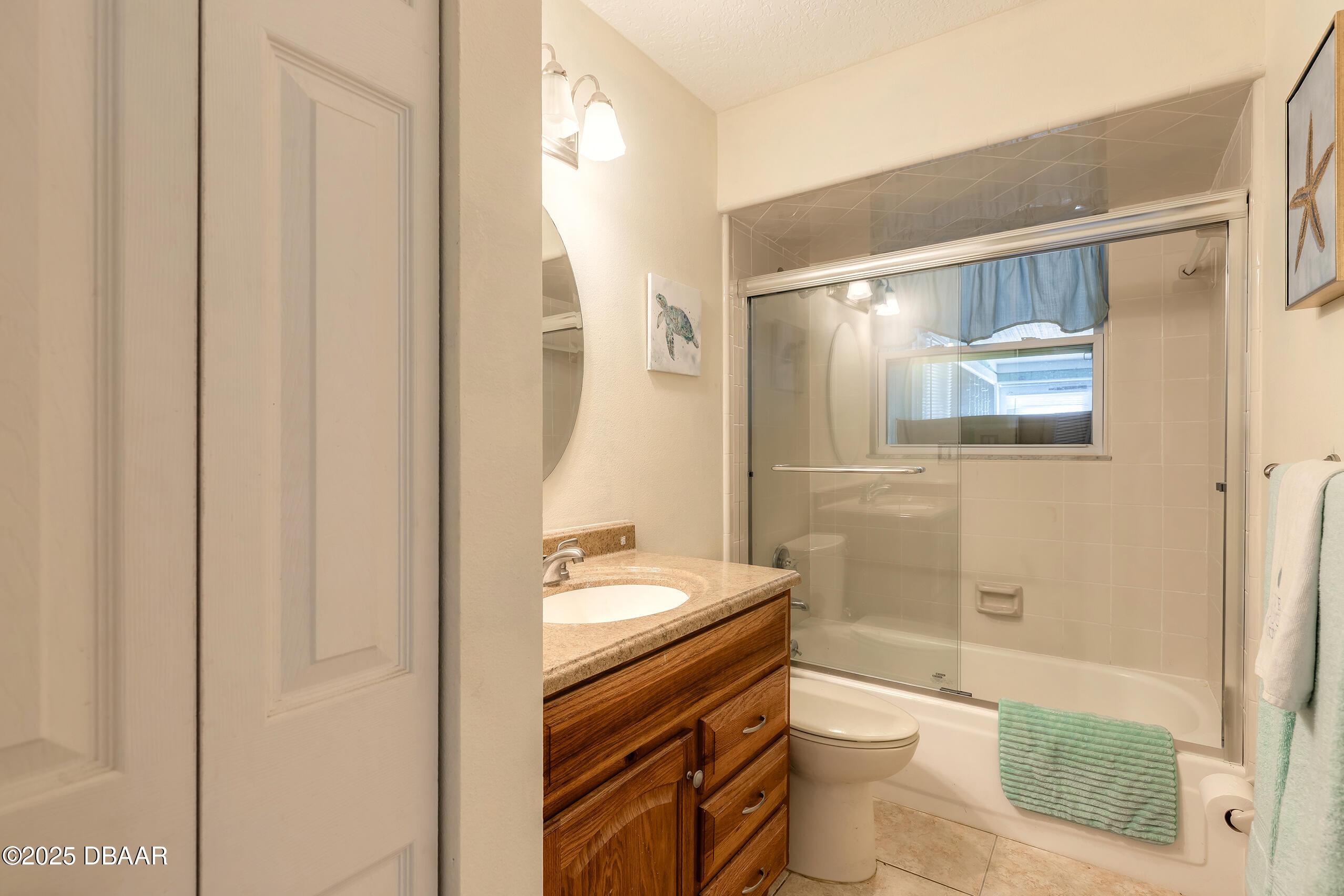 601 Sea Gull Court Edgewater, FL 32141 - Photo 16 of 25 a bathroom with a granite countertop sink toilet and shower