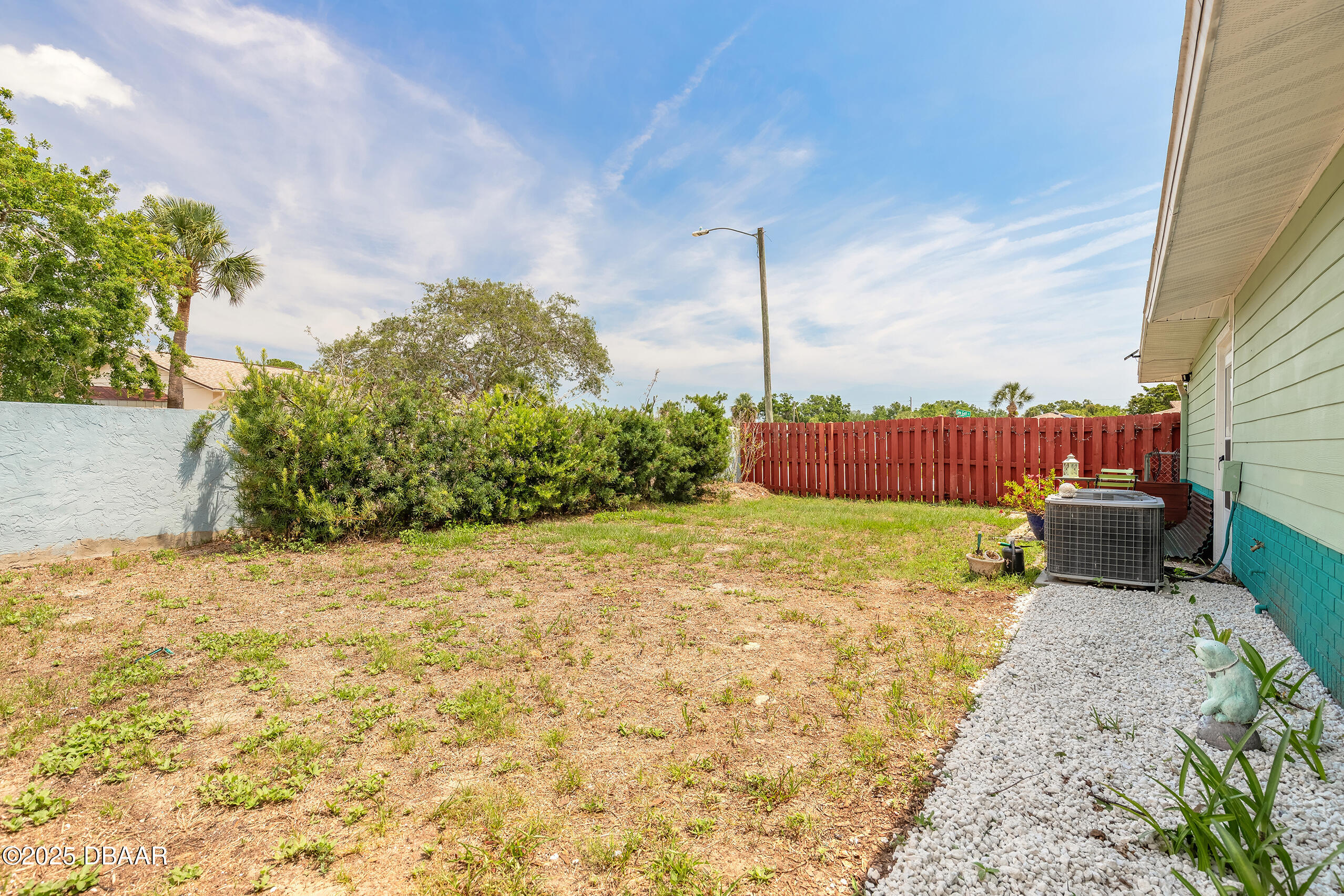601 Sea Gull Court Edgewater, FL 32141 - Photo 22 of 25 a wooden bench sitting in the middle of a yard
