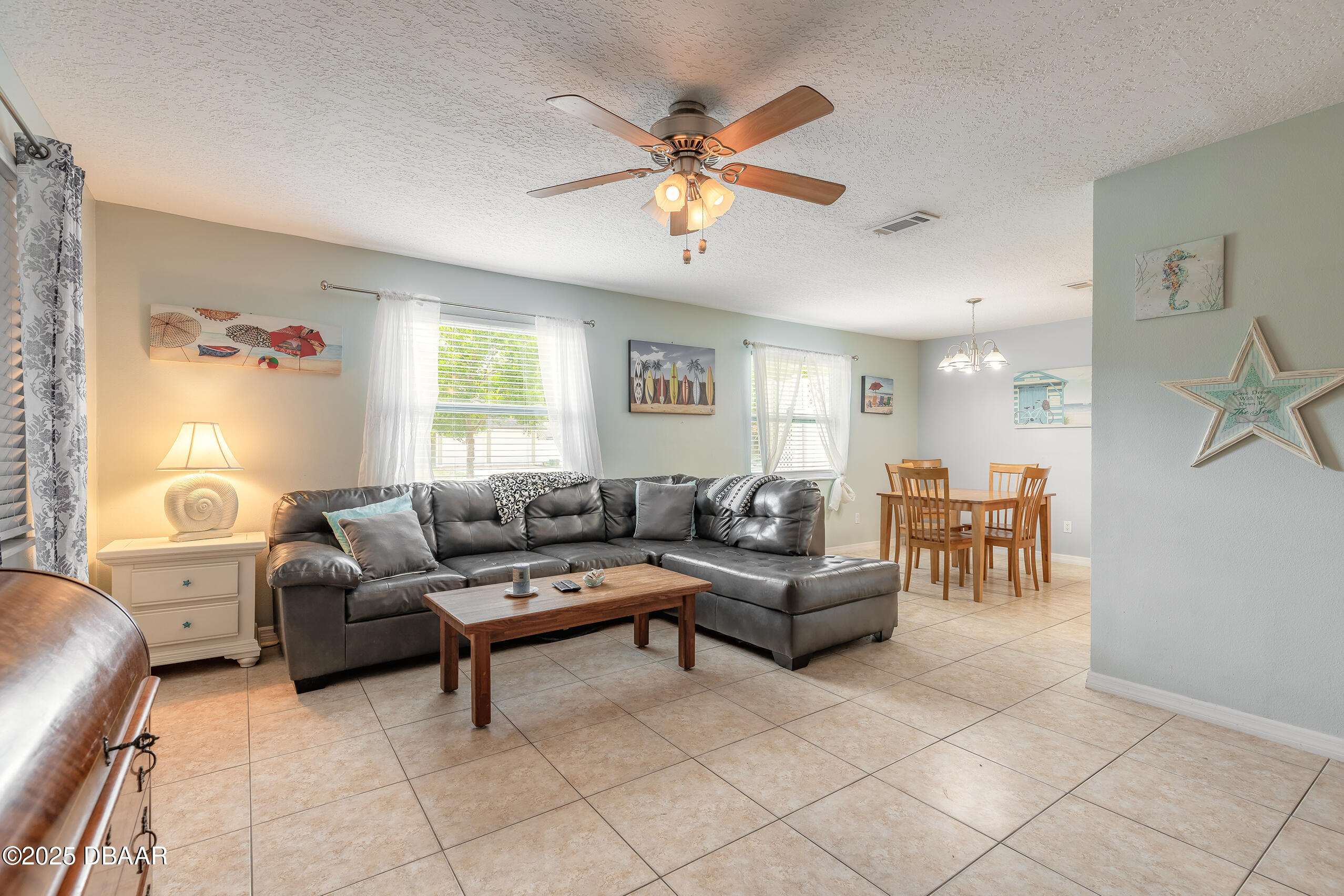 601 Sea Gull Court Edgewater, FL 32141 - Photo 6 of 25 a living room with furniture and a window