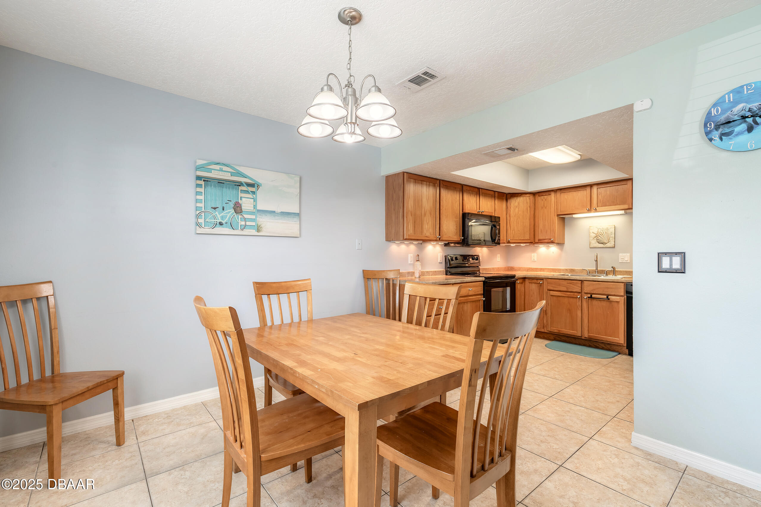 601 Sea Gull Court Edgewater, FL 32141 - Photo 10 of 25 a view of a dining room with furniture and a chandelier