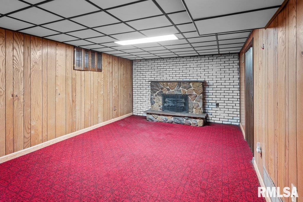 4234 9th Street Rock Island, IL 61201 - Photo 13 of 22 a view of empty room with wooden floor and fireplace