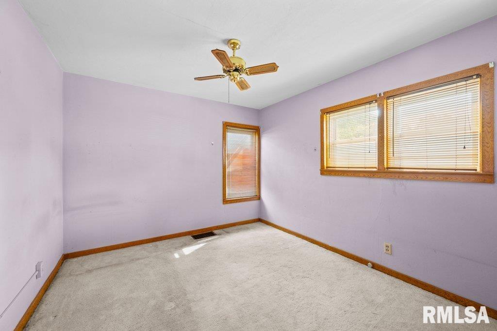 4234 9th Street Rock Island, IL 61201 - Photo 8 of 22 an empty room with windows and fan