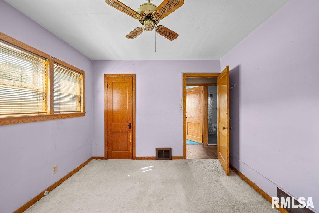 4234 9th Street Rock Island, IL 61201 - Photo 9 of 22 an empty room with windows and fan