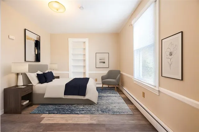 a living room with furniture and a rug