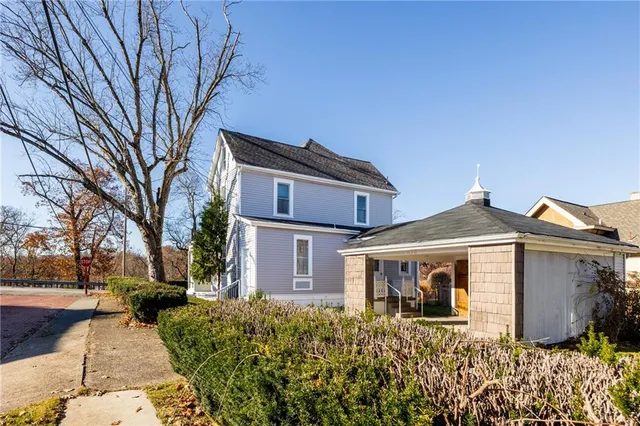 a front view of a house with garden