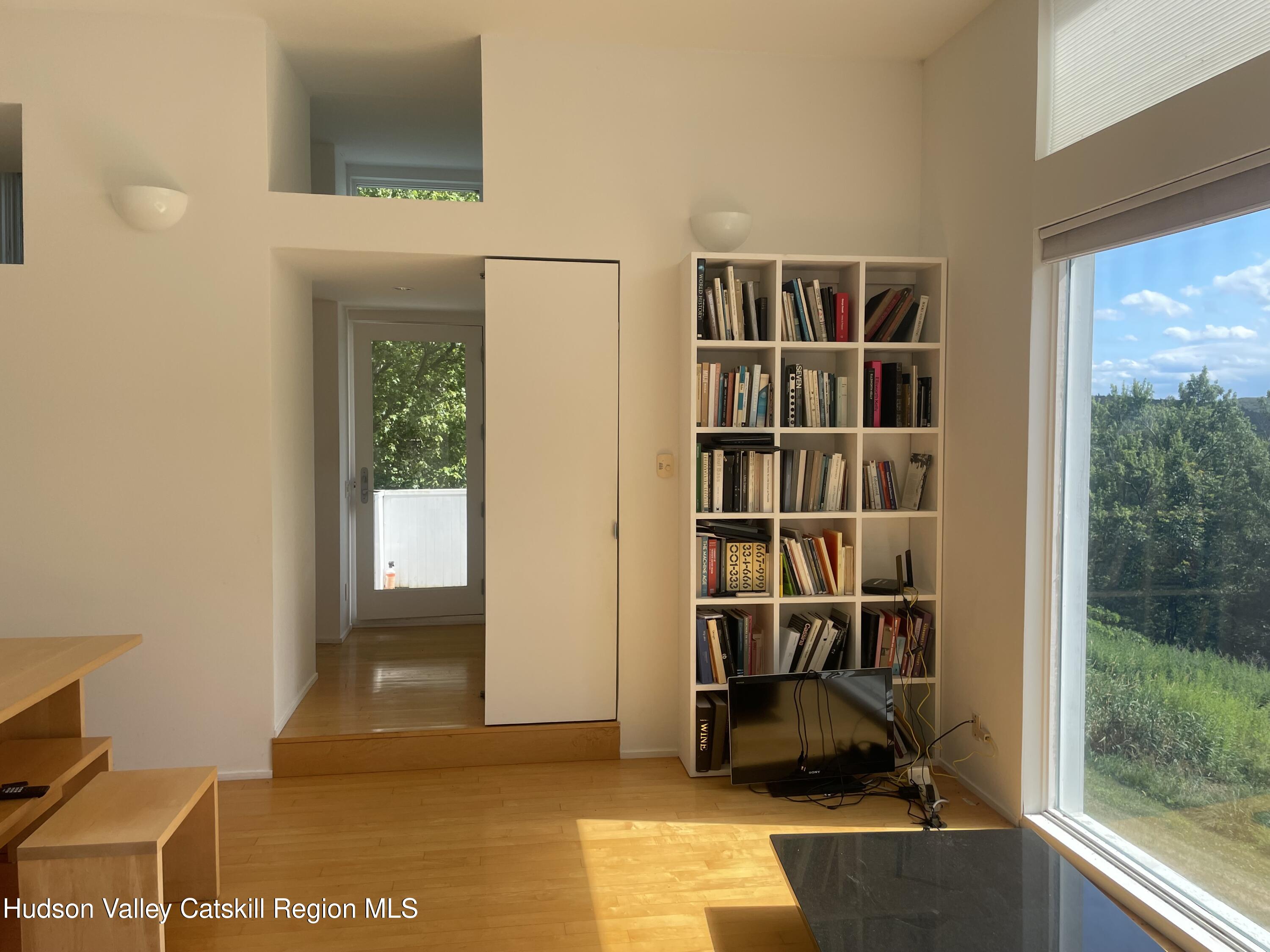 156 Mercer Mountain Road Canaan, NY 12060 - Photo 11 of 28 a view of a workspace with furniture and a window