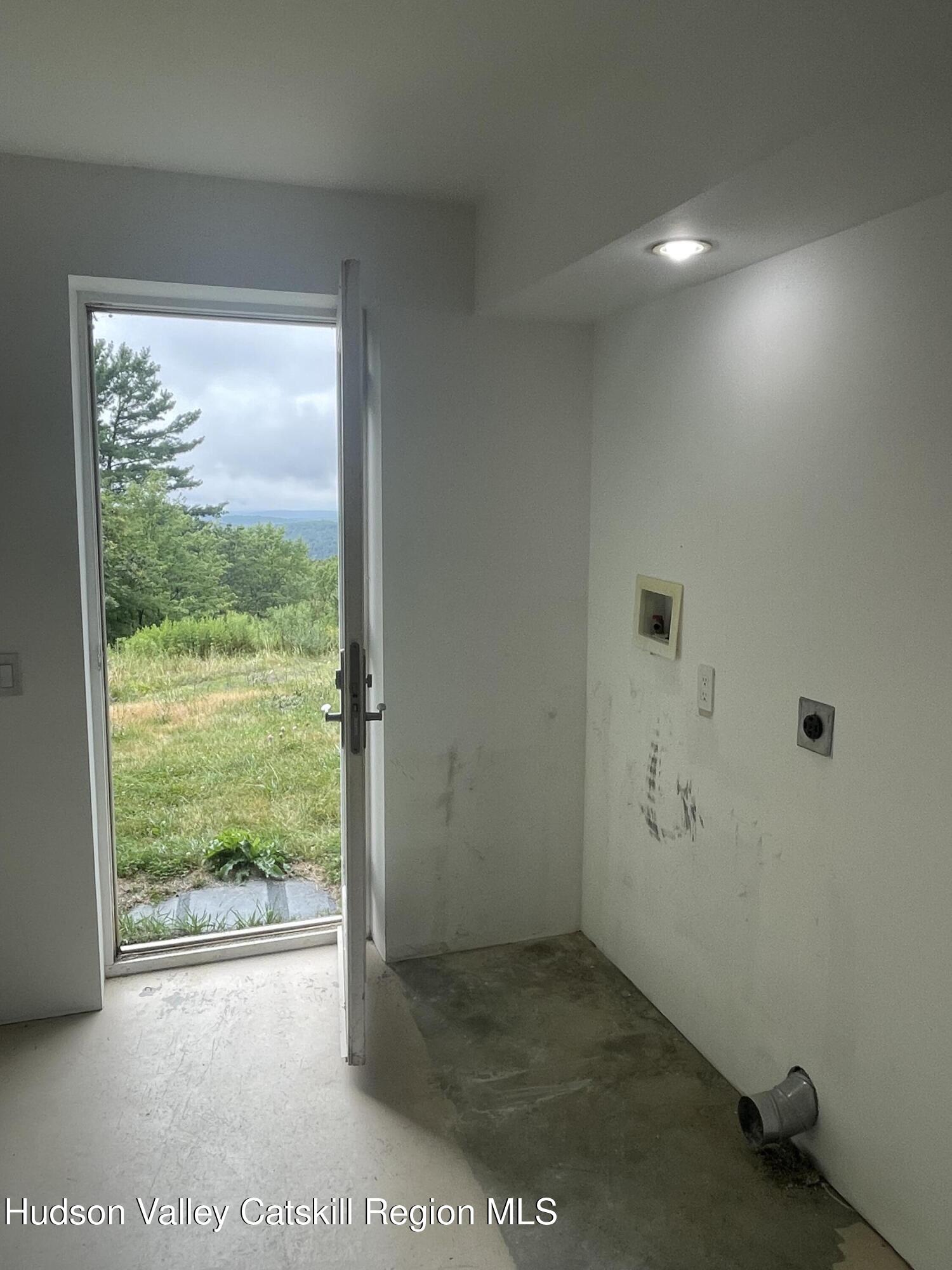 156 Mercer Mountain Road Canaan, NY 12060 - Photo 19 of 28 a view of an empty room and window