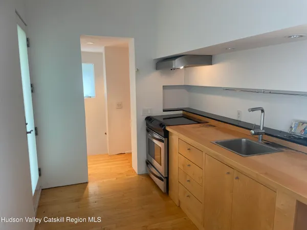 a kitchen with a sink and a refrigerator