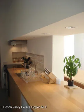 a bathroom with a sink a faucet and a mirror