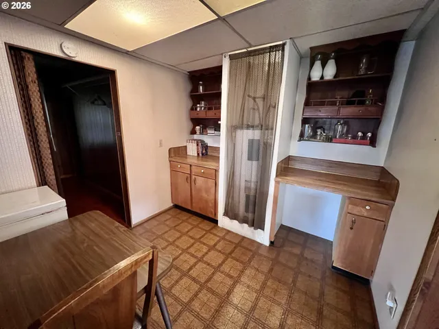 a kitchen with stainless steel appliances a refrigerator and cabinets