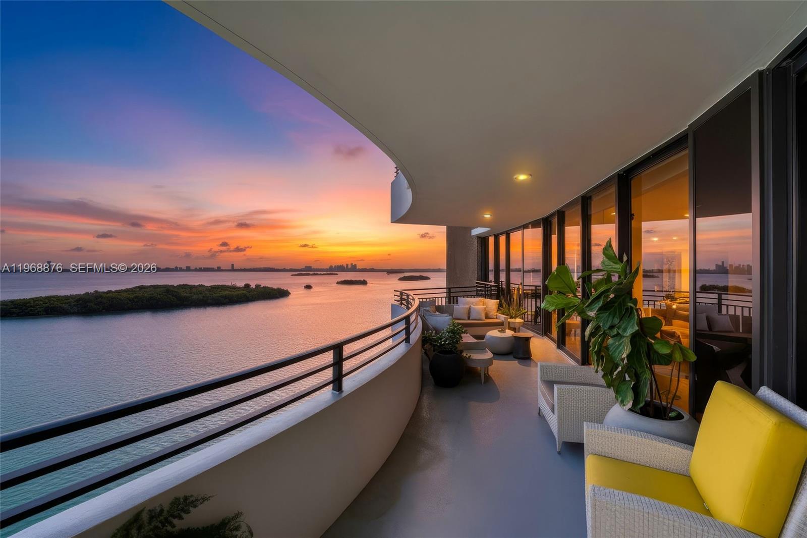 a view of balcony with couch and chairs